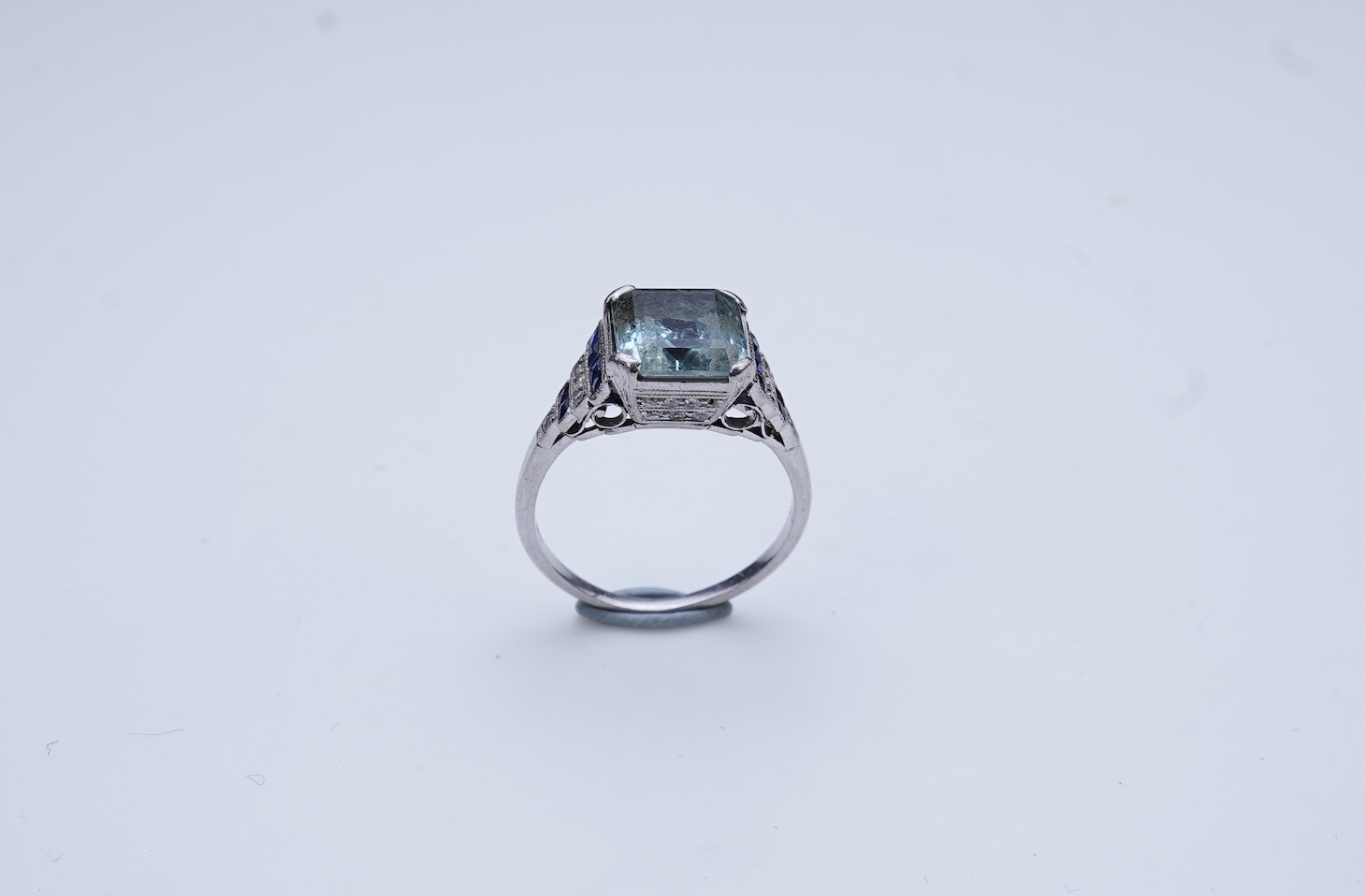 An aquamarine, sapphire and diamond ring
